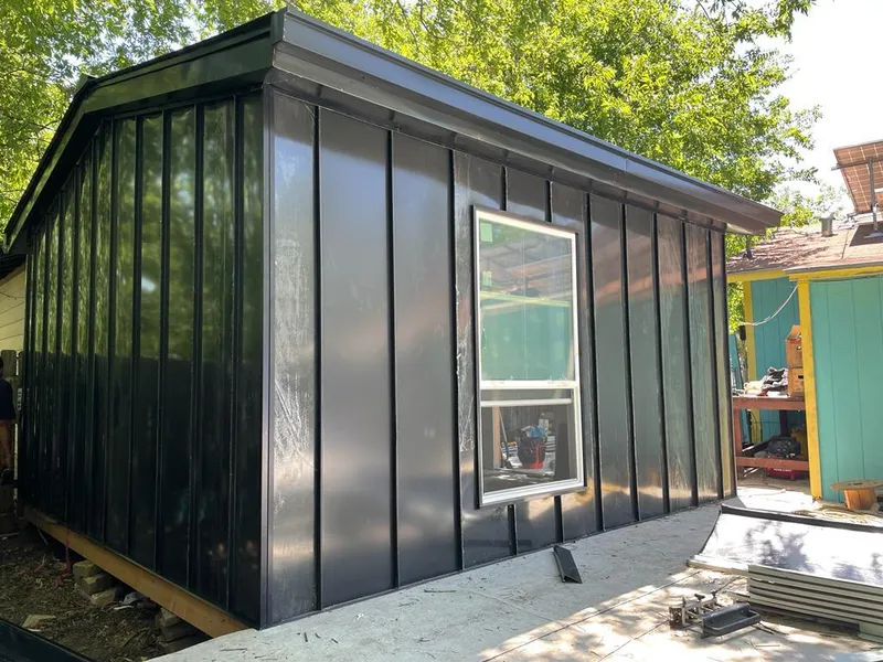 Black standing seam metal wall panels for Roof Inspection in Poquoson