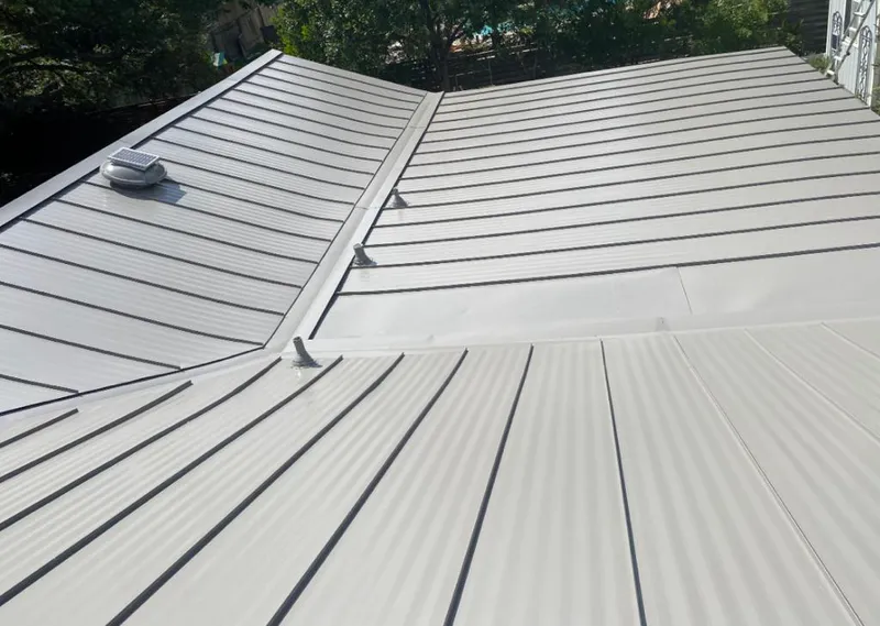 Solar attic fan installed on a metal roof for Roof Ventilation in Poquoson